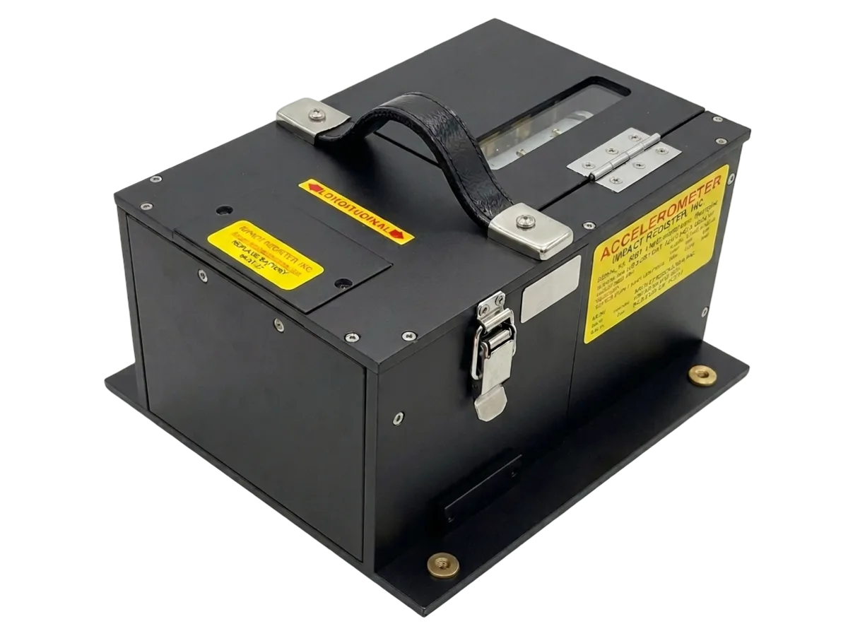 The RM-3WE three-axis impact recorder: a black steel case on a mounting base plate, with a carrying handle, a draw latch, and the yellow Impact Register accelerometer nameplate