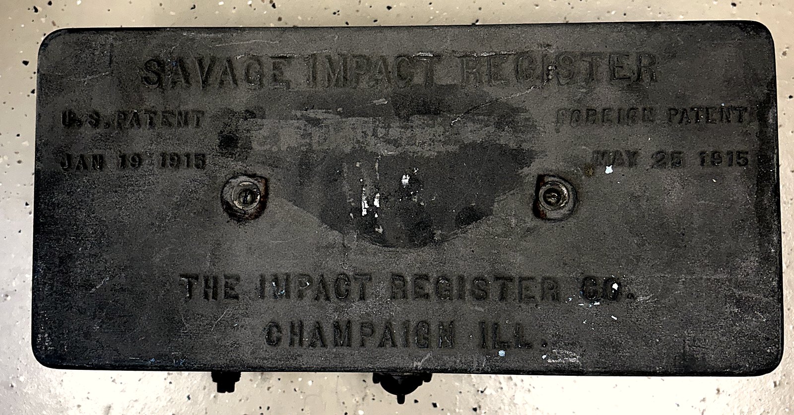 The cast cover plate of the Savage Impact Register, embossed with Savage Impact Register, U.S. Patent Jan 19 1915, Foreign Patent May 25 1915, and The Impact Register Co., Champaign, Ill.